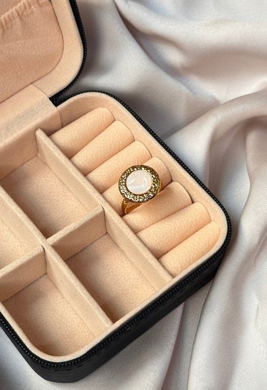 White stone ring in golden